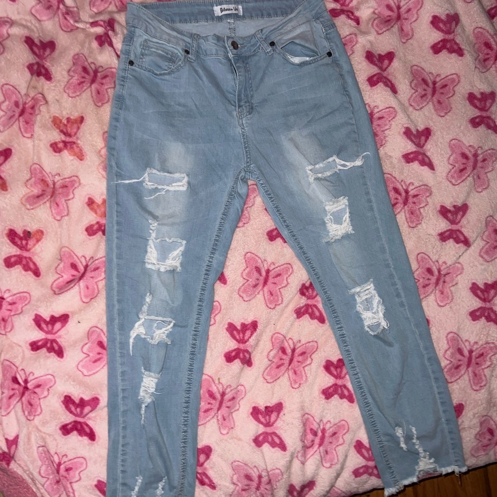 Ripped jeans, light blue color